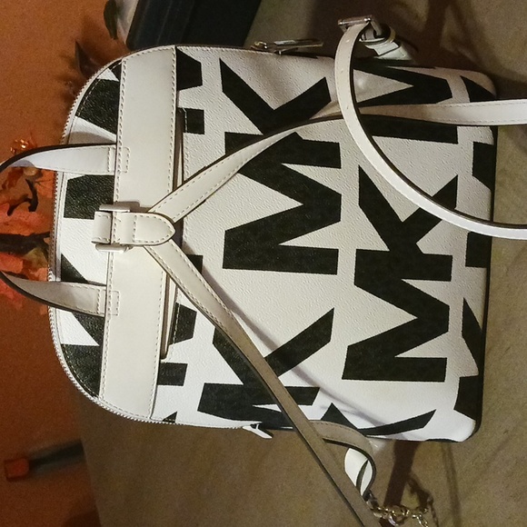 Michael kors purse backpack, white leather, with black MK on it. - Picture 1 of 4